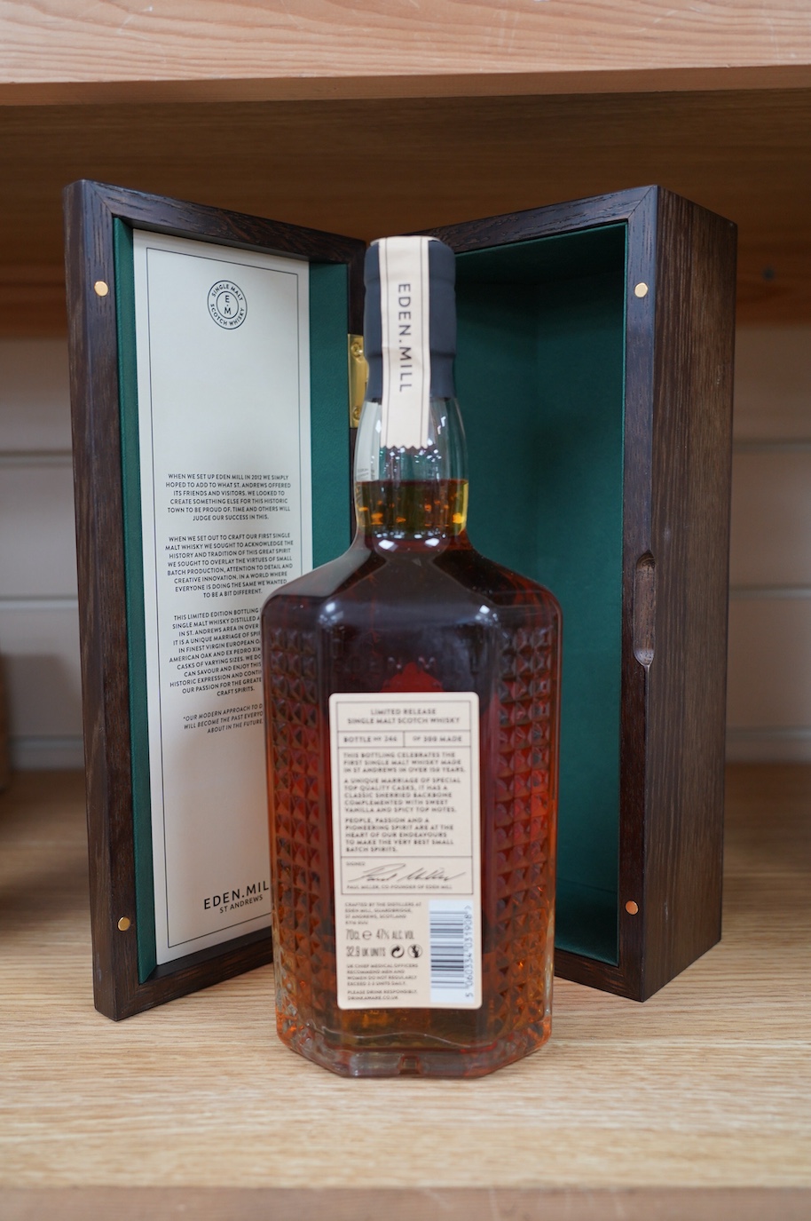 An oak cased bottle of Eden Mill first bottling single malt whisky No. 246 of 300. Condition - good